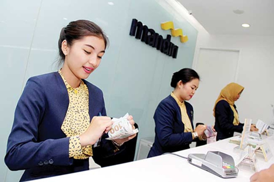 <p>Petugas Bank Mandiri. Berikut simulasi angsurat KUR Mandiri 2025, simak cara dan syarat pengajuan modal usaha bagi UMKM. (Foto: Bank Mandiri).</p>
